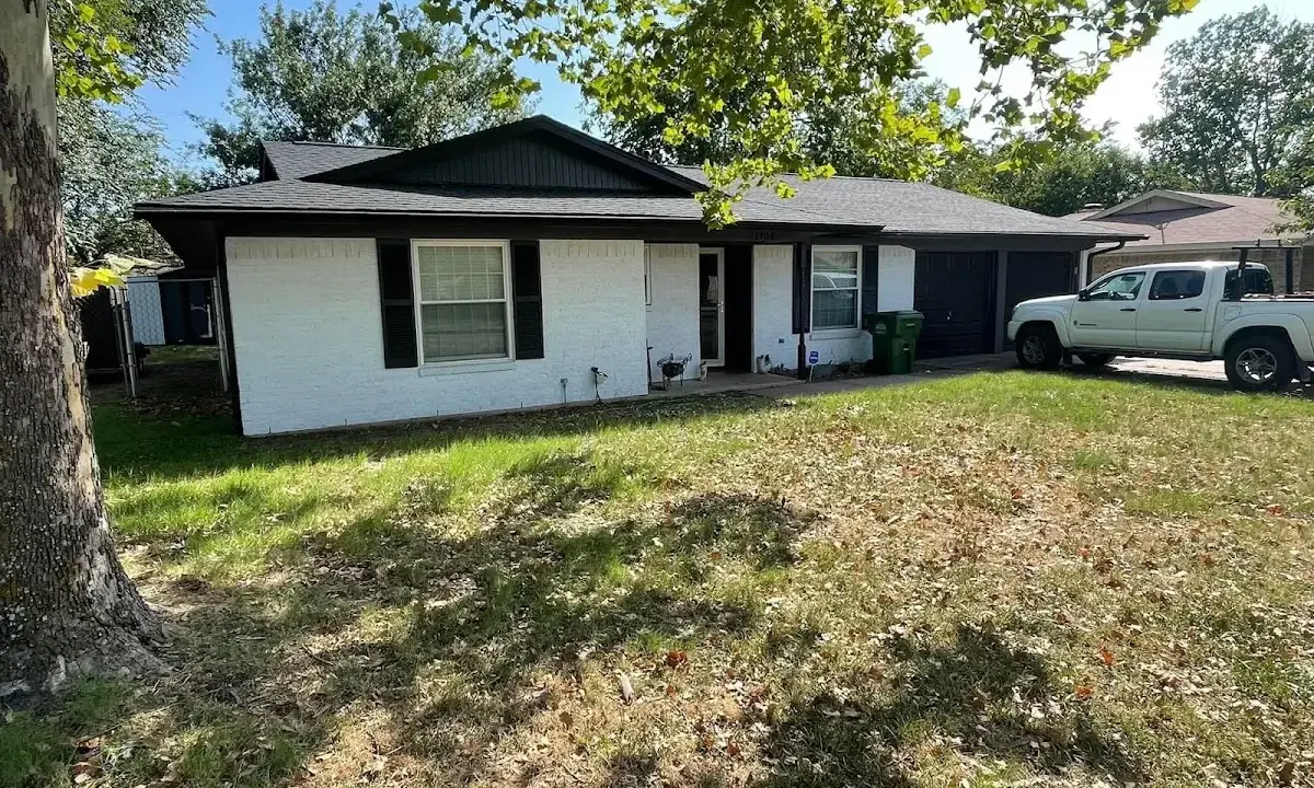 Professional roofing crew working on a residential roof in Scranton
